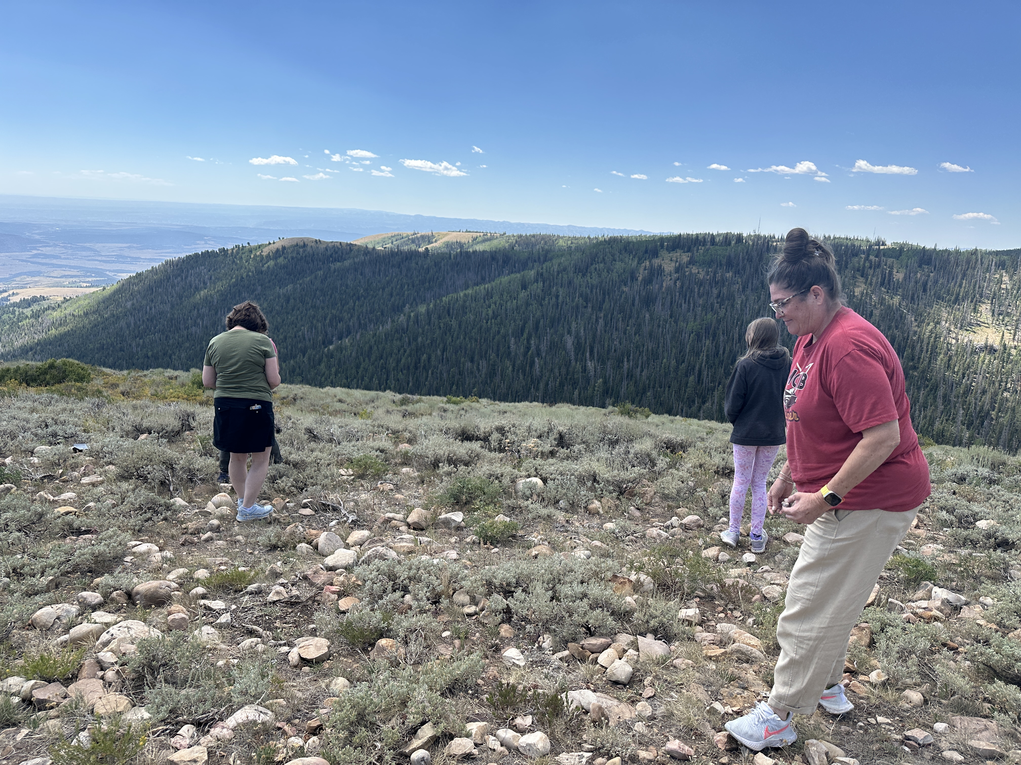 Guests on the mountain with sweeping valley views